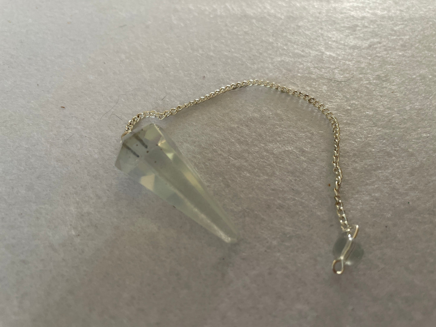 Beautiful Opalite pendulum is approximately 1.5” and with chain is 8.25” total length.