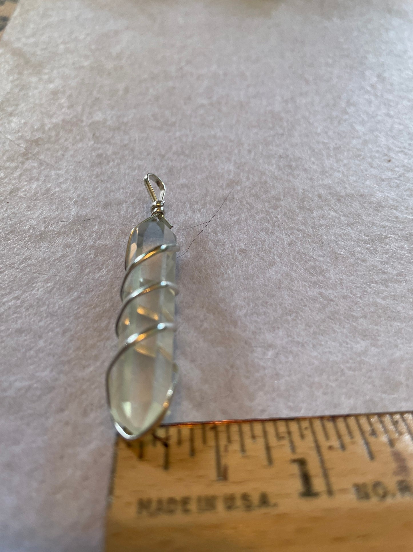 Beautiful Clear Quartz Point Pendant is  1.50” and is attached to precious silver making the total length 2”