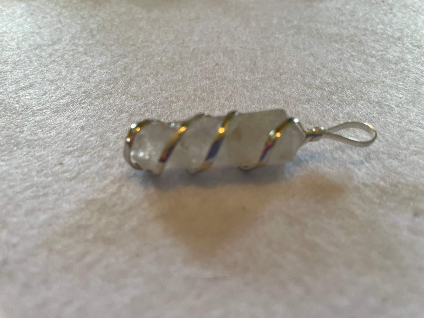 Beautiful Clear Quartz Point Pendant is  1.50” and is attached to precious silver making the total length 2”