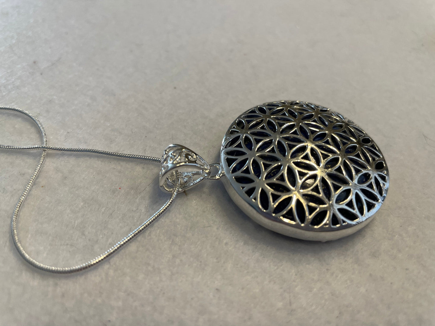 Silver round Flower of Life Lapis Lazuli crystal necklace on 16+ inch silver plated chain