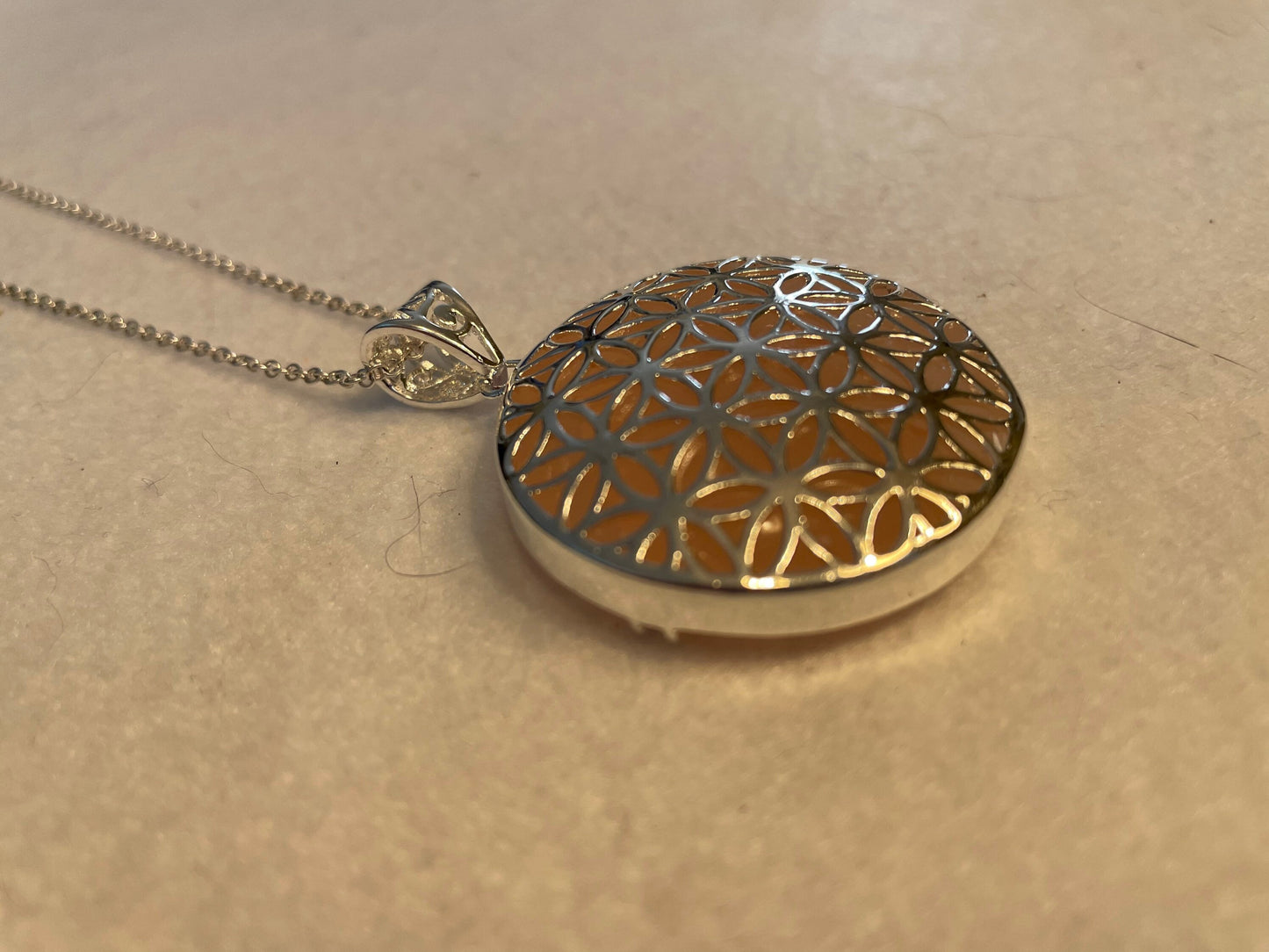 Silver round Flower of Life Rose Quartz crystal necklace on 16+ inch silver plated chain
