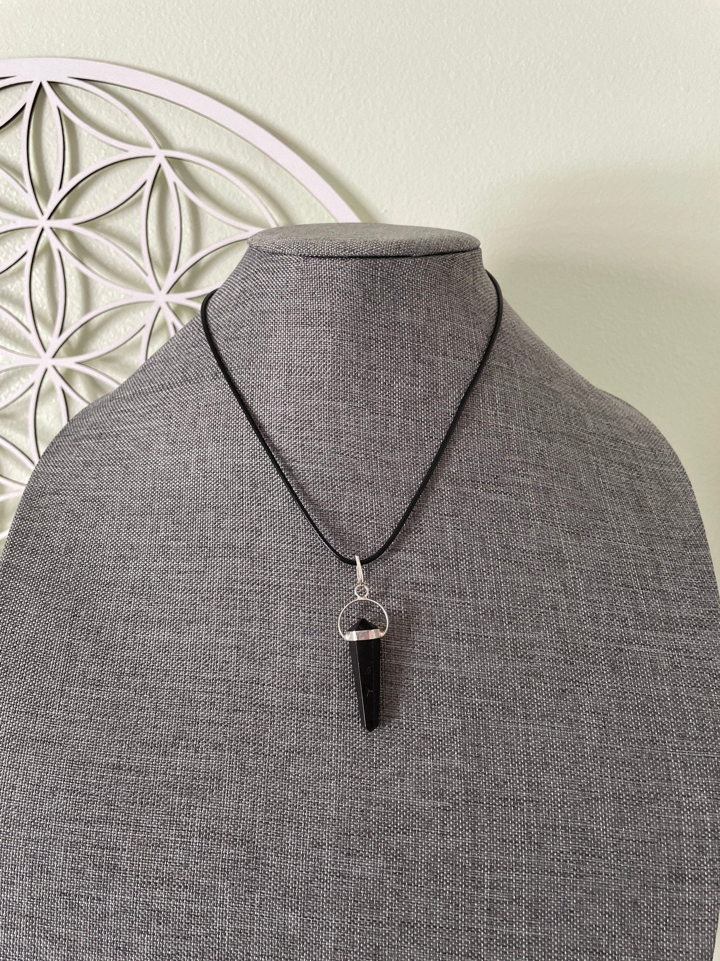 Super sharp looking black obsidian point necklace on black cord