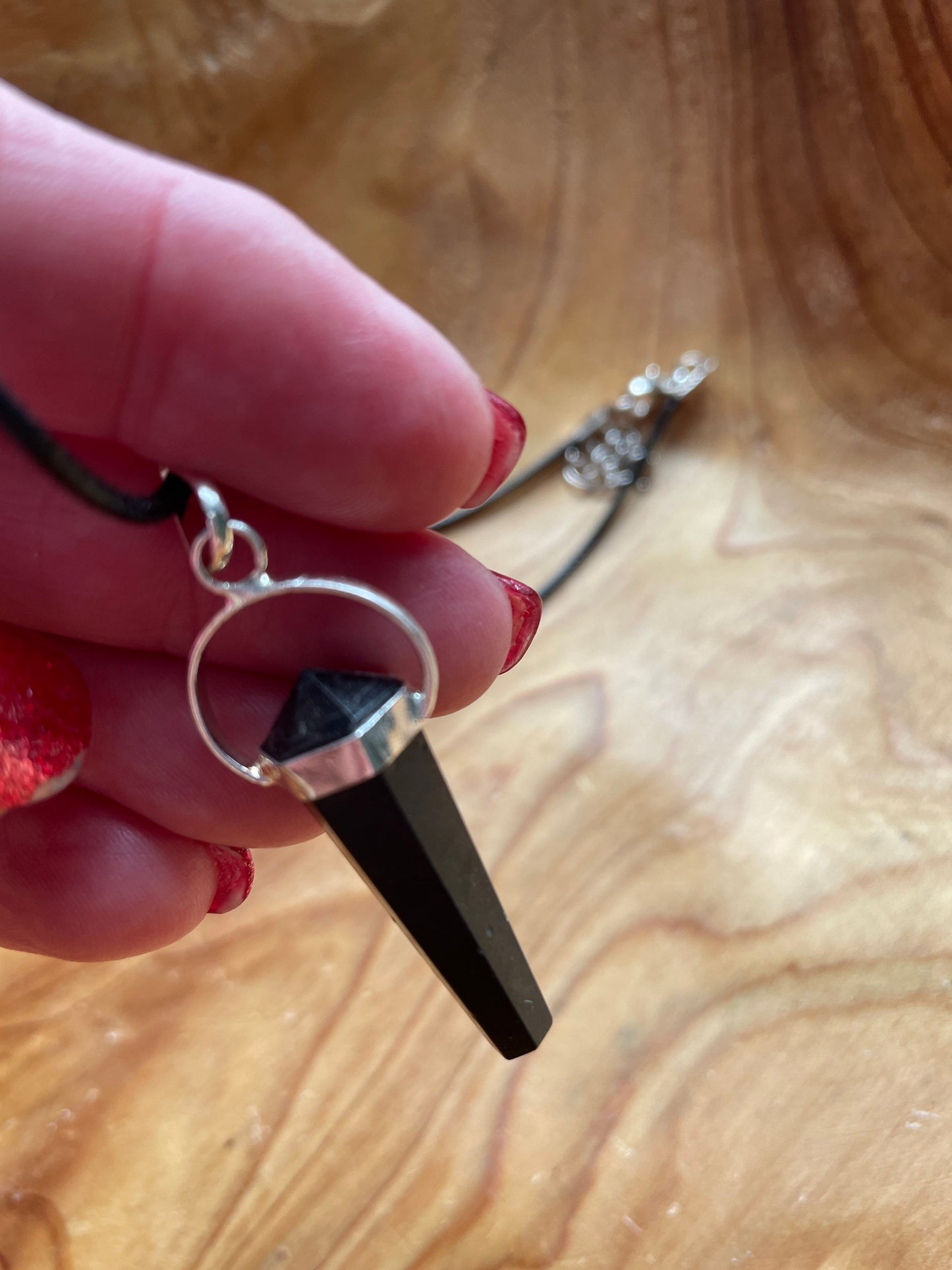 Super sharp looking black obsidian point necklace on black cord