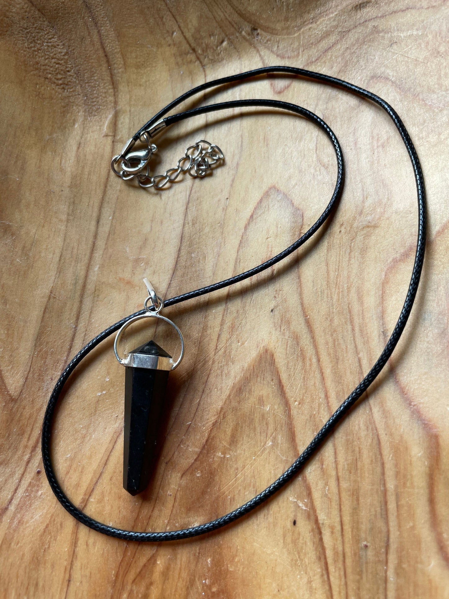 Super sharp looking black obsidian point necklace on black cord
