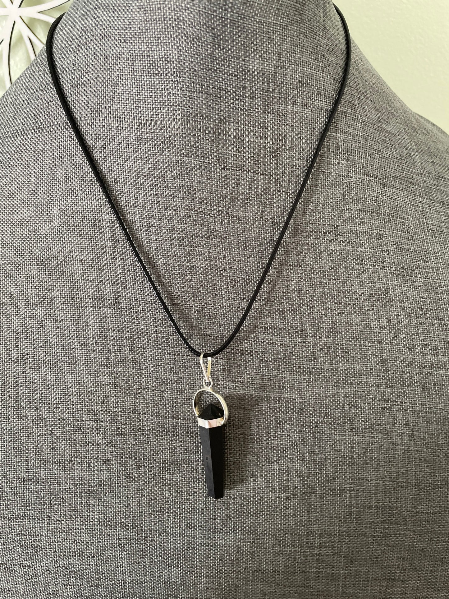 Beautiful black obsidian point pendant necklace wrapped in silver on a black nylon cord