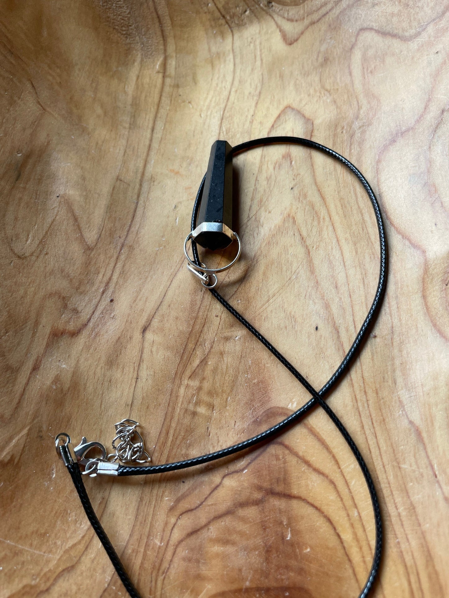 Gorgeous black obsidian point pendant wrapped with silver on a nylon cord