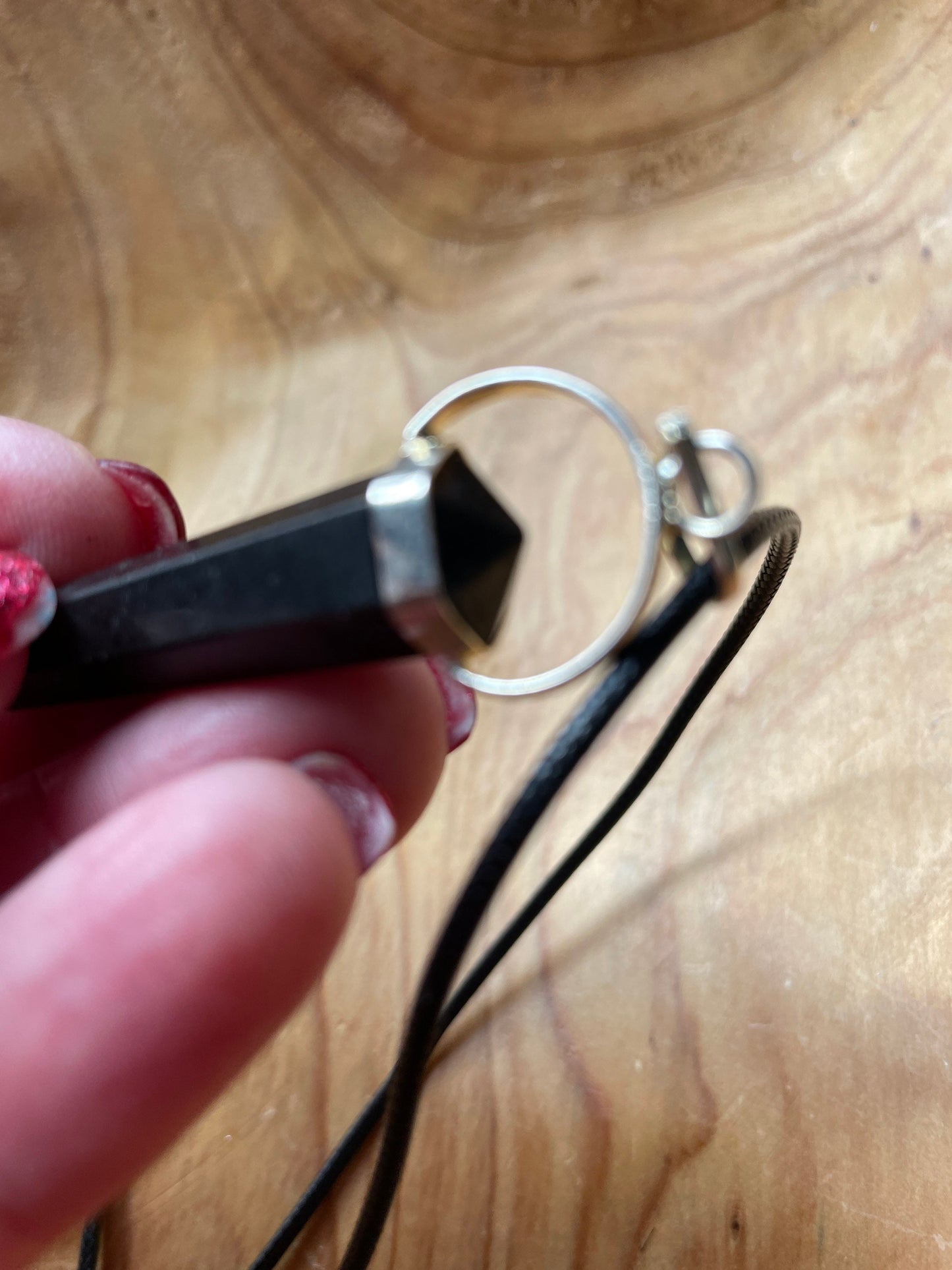 Gorgeous black obsidian point pendant wrapped with silver on a nylon cord