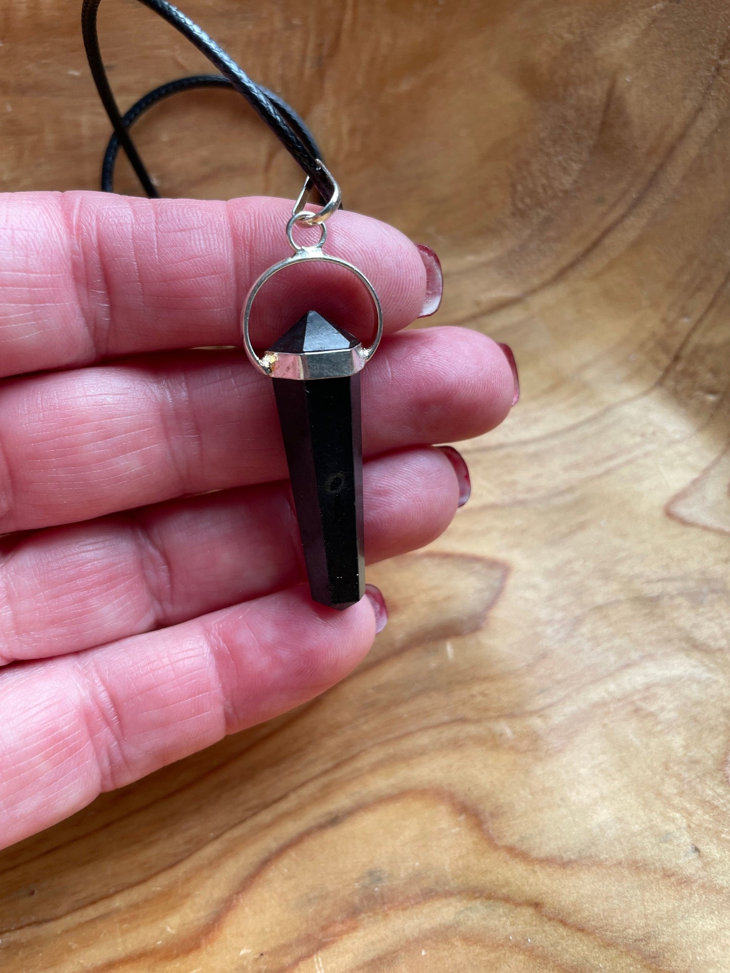 Beautiful black obsidian point pendant necklace wrapped in silver on a black nylon cord