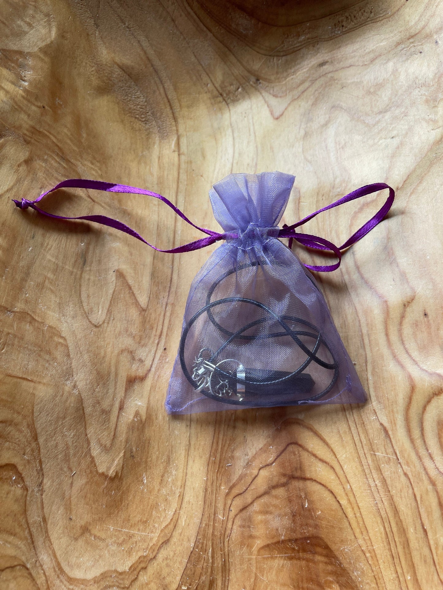 Beautiful black obsidian point pendant necklace wrapped in silver on a black nylon cord