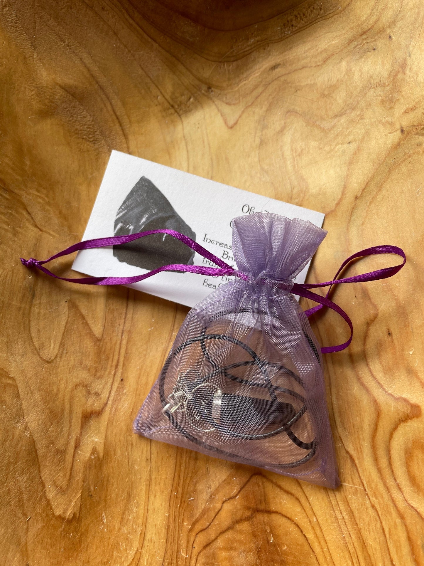 Gorgeous black obsidian point pendant wrapped with silver on a nylon cord