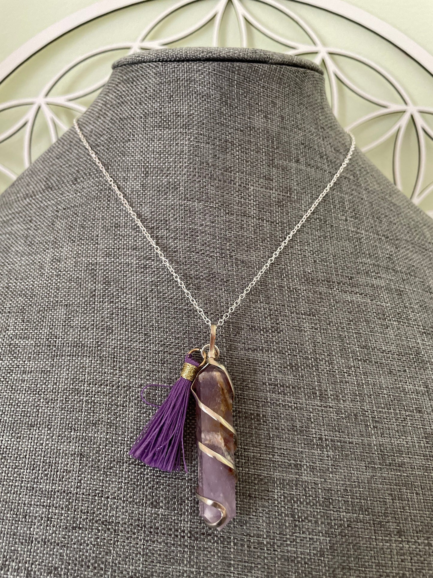 Gorgeous Banded Amethyst double Point Pendant is 2” and is attached to precious silver making the total length almost 2.25” with purple Pom