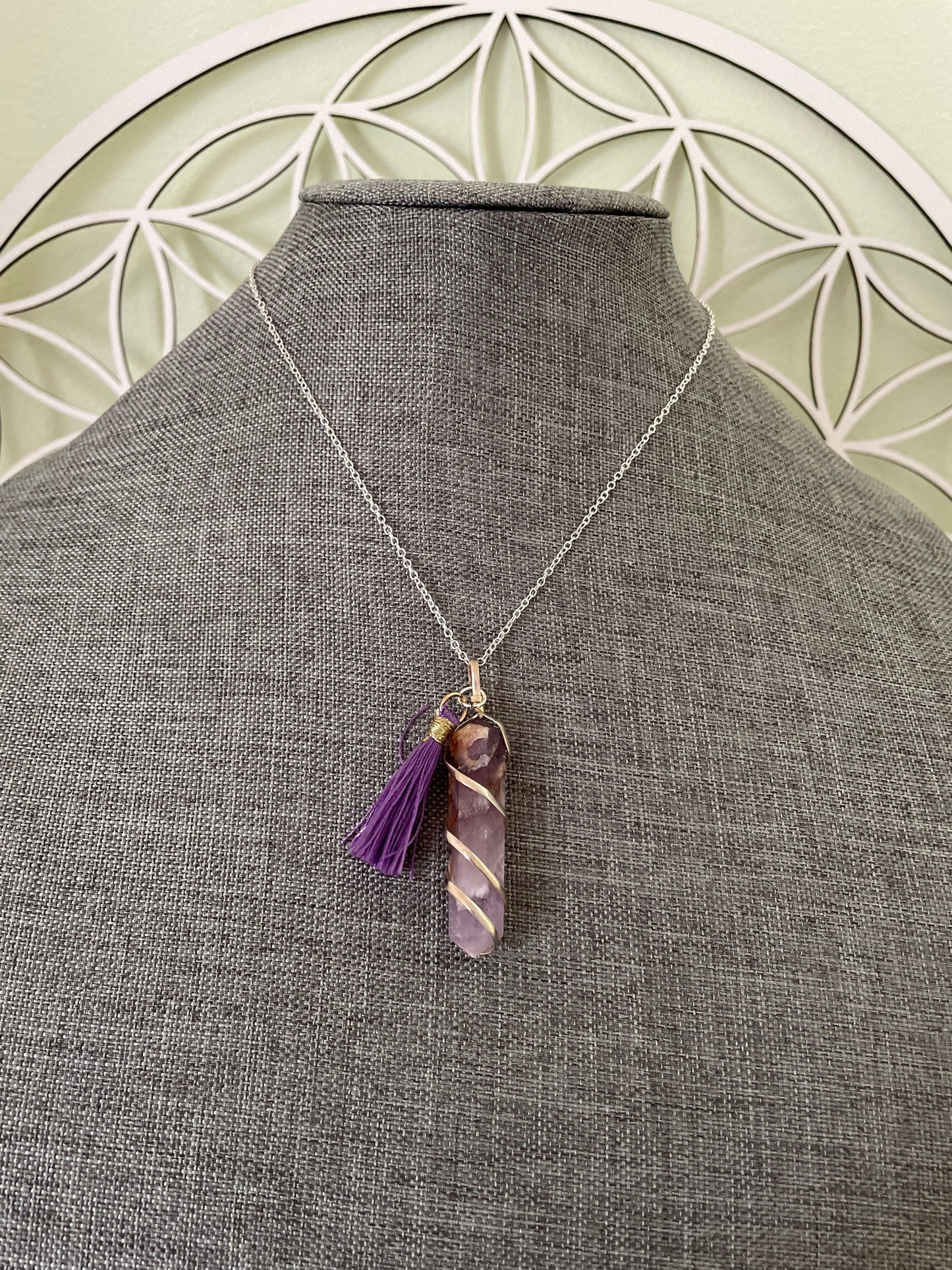 Gorgeous Banded Amethyst double Point Pendant is 2” and is attached to precious silver making the total length almost 2.25” with purple Pom