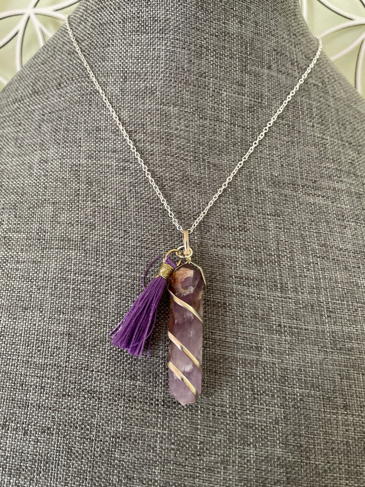 Gorgeous Banded Amethyst double Point Pendant is 2” and is attached to precious silver making the total length almost 2.25” with purple Pom