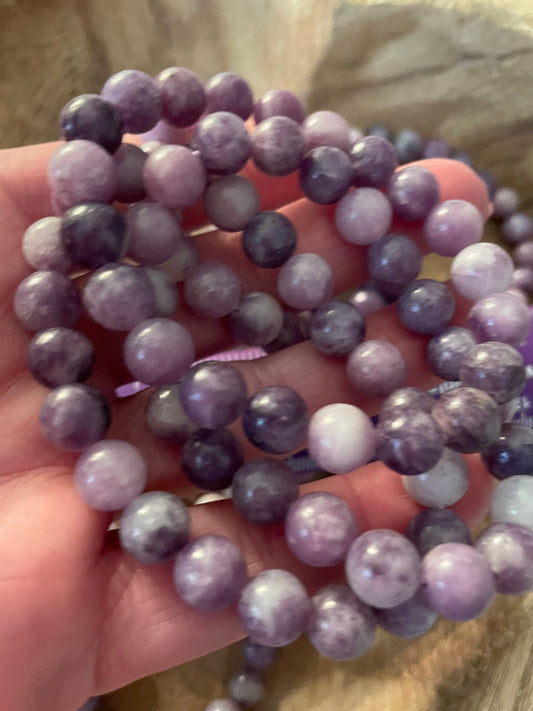 Beautiful Lepidolite 8mm bracelets on elastic band. One size fits all.