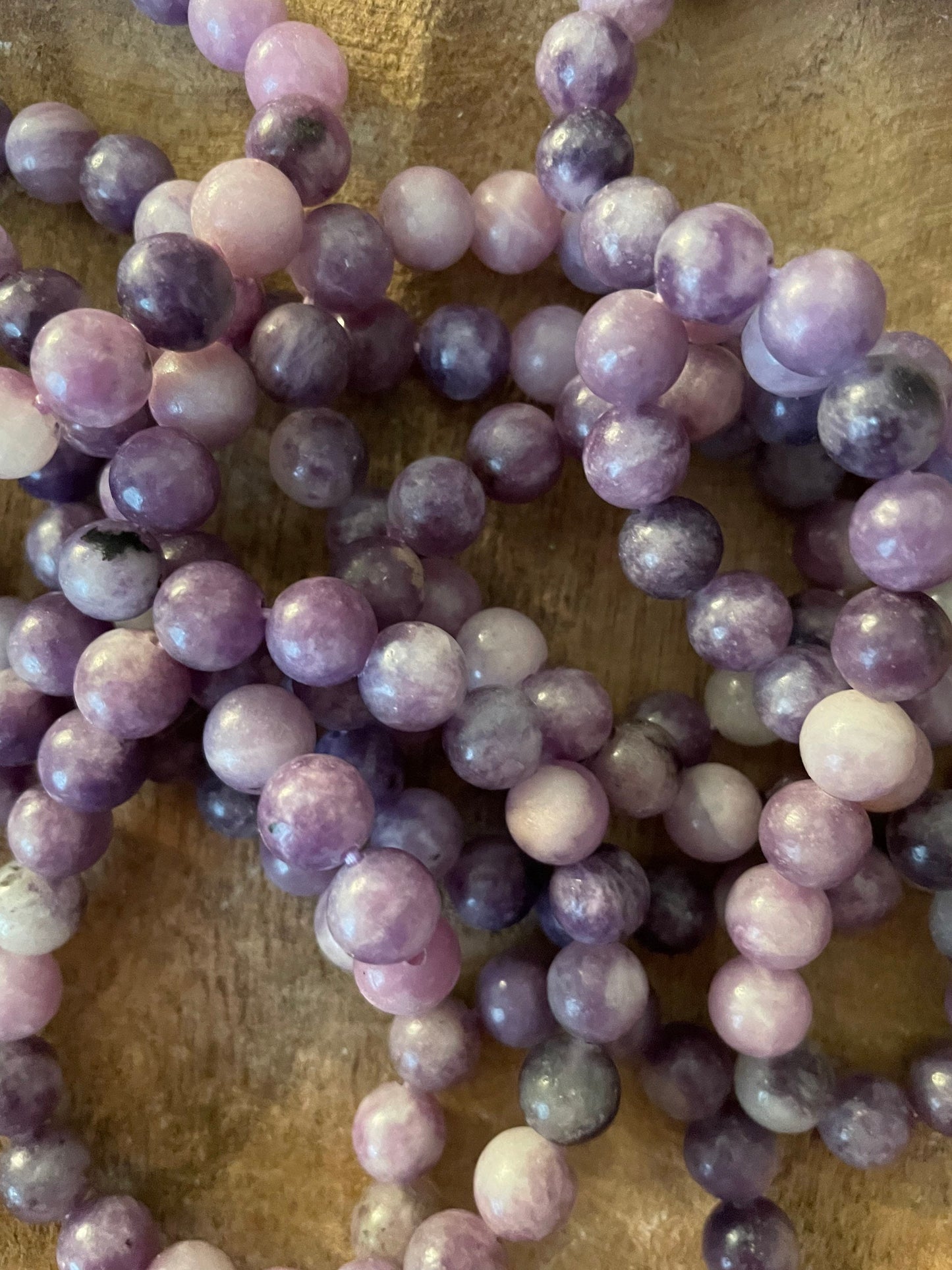 Beautiful Lepidolite 8mm bracelets on elastic band. One size fits all.