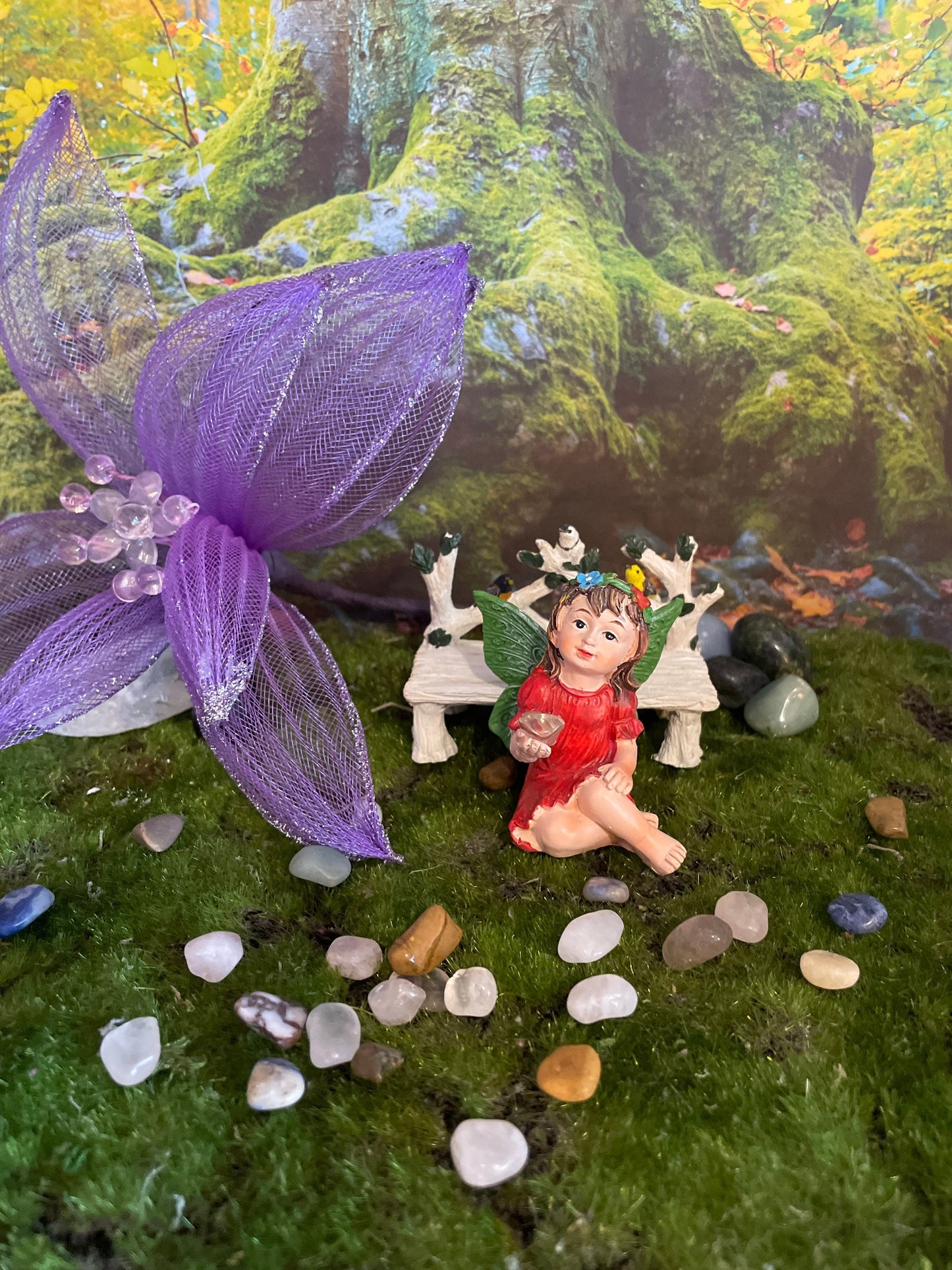 Look at her sweet face and she’s holding a clear quartz crystal hand-painted fairy with crystals