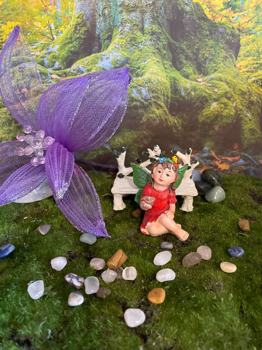Look at her sweet face and she’s holding a clear quartz crystal hand-painted fairy with crystals