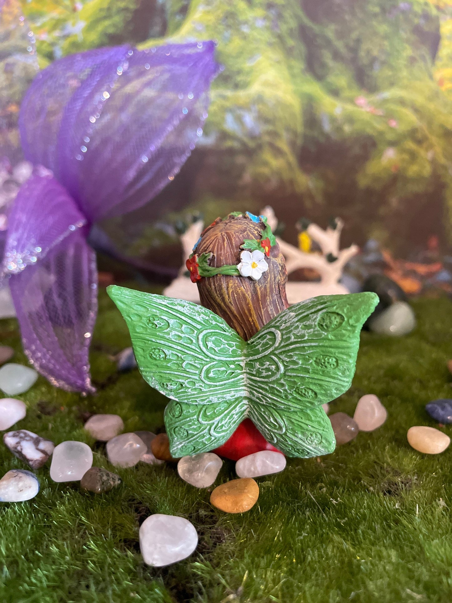 Look at her sweet face and she’s holding a clear quartz crystal hand-painted fairy with crystals