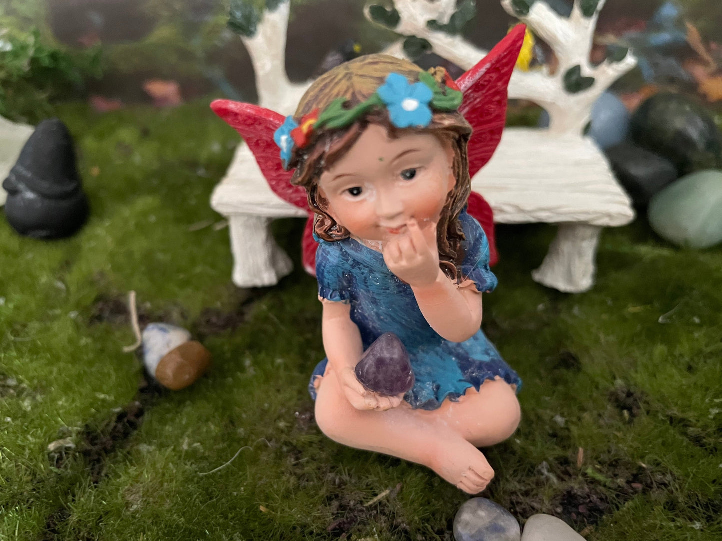Look at her sweet face and she’s holding an amethyst crystal hand-painted fairy with crystals