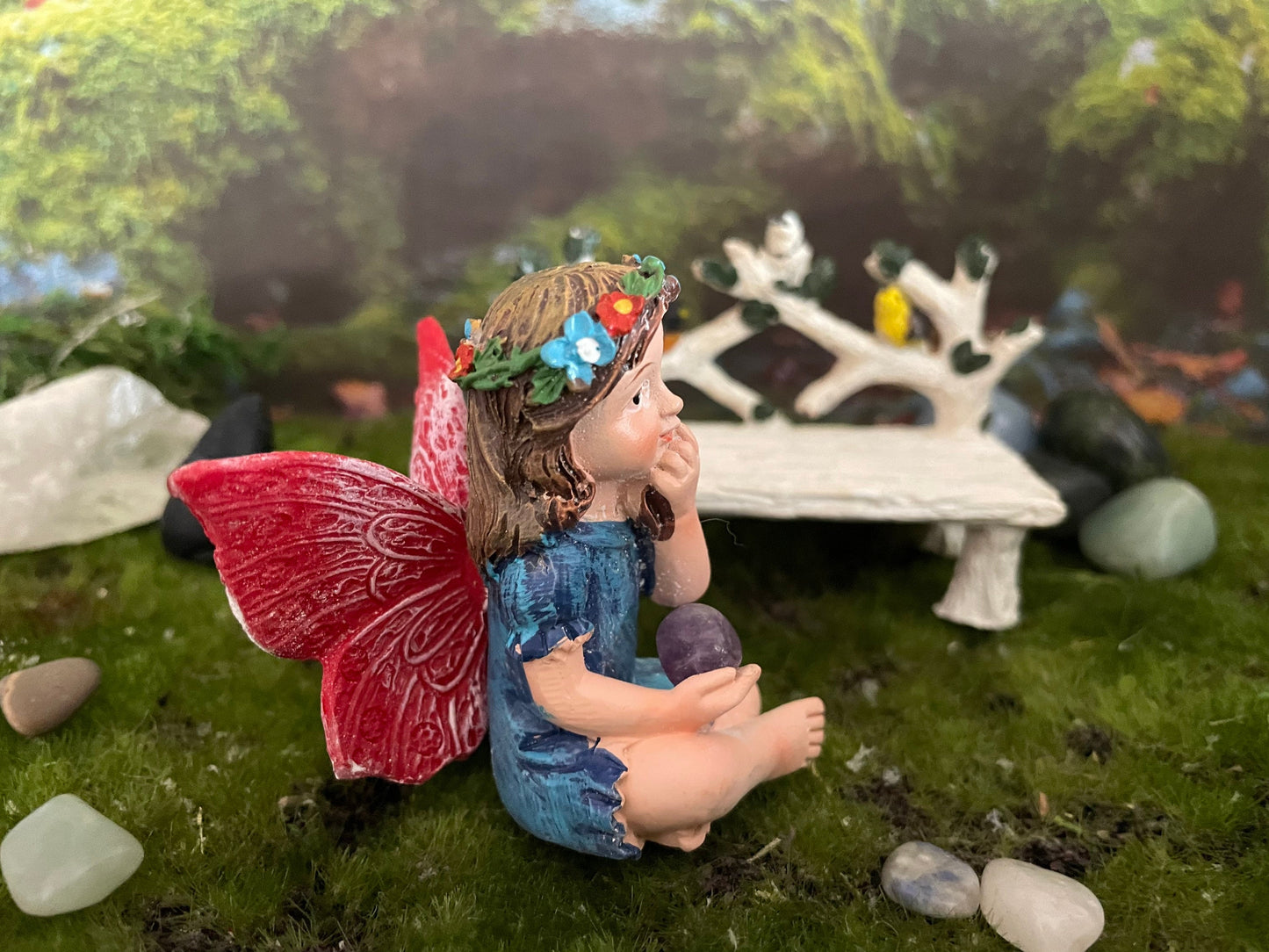 Look at her sweet face and she’s holding an amethyst crystal hand-painted fairy with crystals