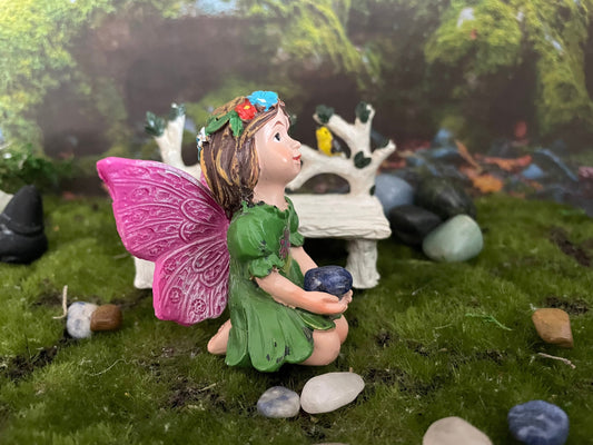 Look at her sweet face and she’s holding an Aventurine crystal hand-painted fairy with crystals