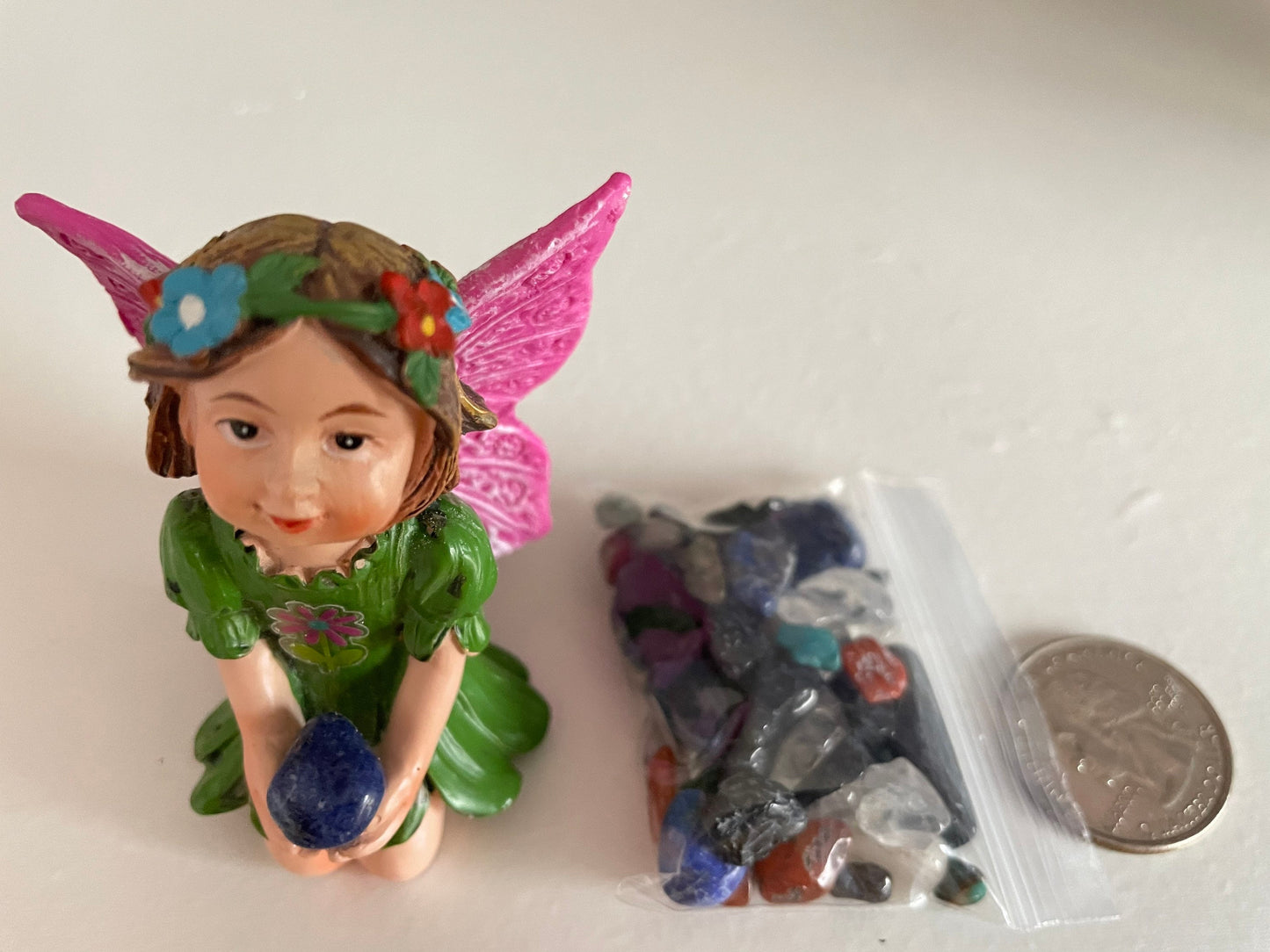 Look at her sweet face and she’s holding an Aventurine crystal hand-painted fairy with crystals
