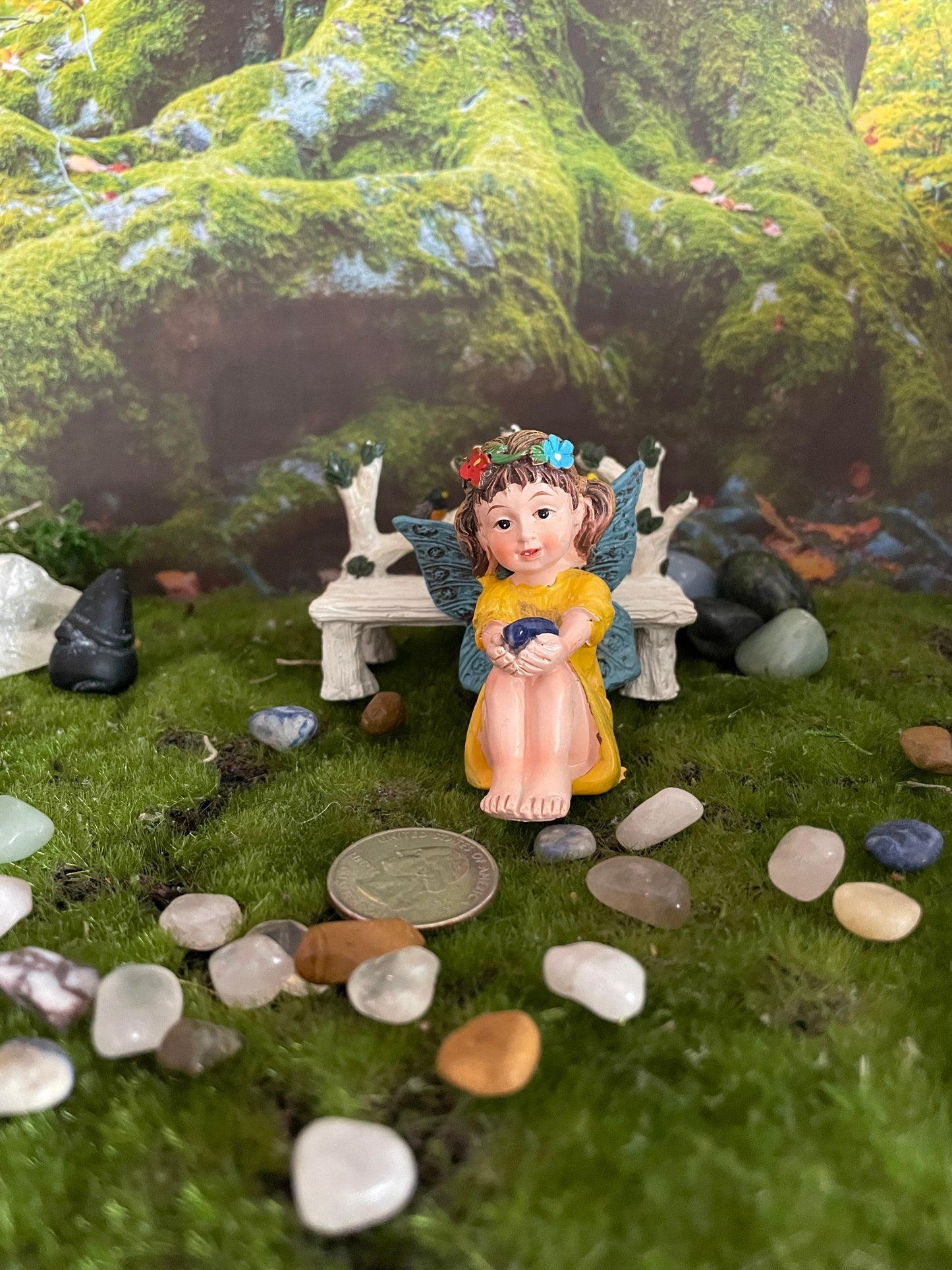 Look at her sweet face and she’s holding a Sodalite crystal hand-painted fairy with crystals