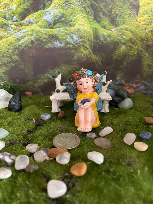 Look at her sweet face and she’s holding a Sodalite crystal hand-painted fairy with crystals