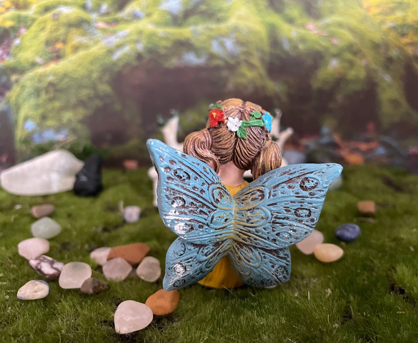 Look at her sweet face and she’s holding a Sodalite crystal hand-painted fairy with crystals