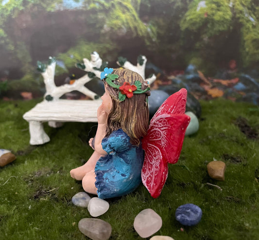 Look at her sweet face and she’s holding an amethyst crystal hand-painted fairy with crystals