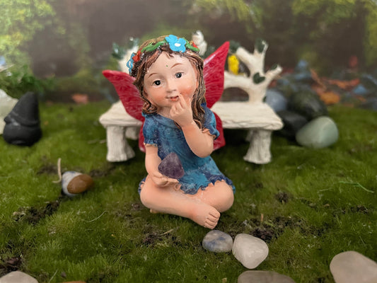 Look at her sweet face and she’s holding an amethyst crystal hand-painted fairy with crystals