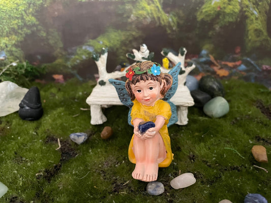 Look at her sweet face and she’s holding a Sodalite crystal hand-painted fairy with crystals
