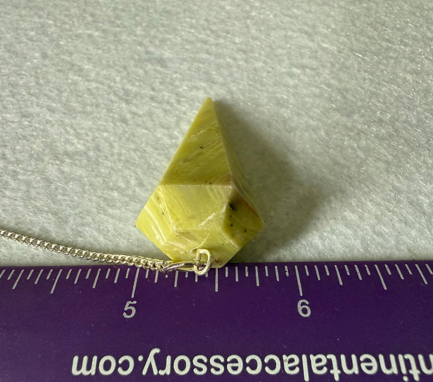 Awesome Serpentine Pendulum is  1.65” and with chain is 9”