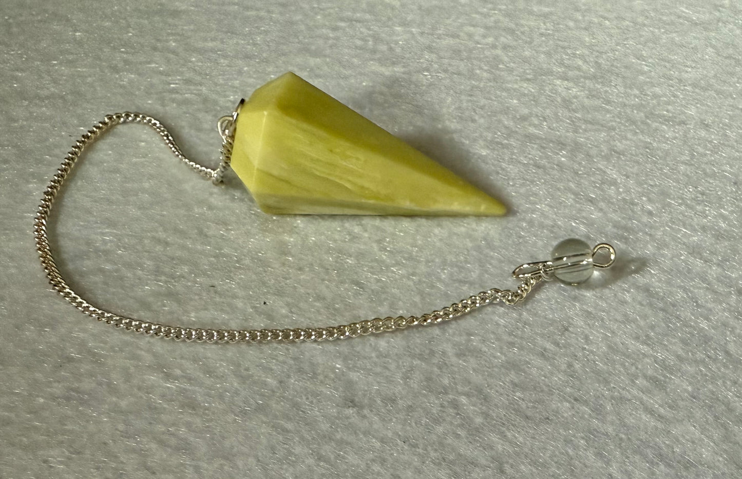 Beautiful Serpentine Pendulum is  1.5” and with chain is 8.5”