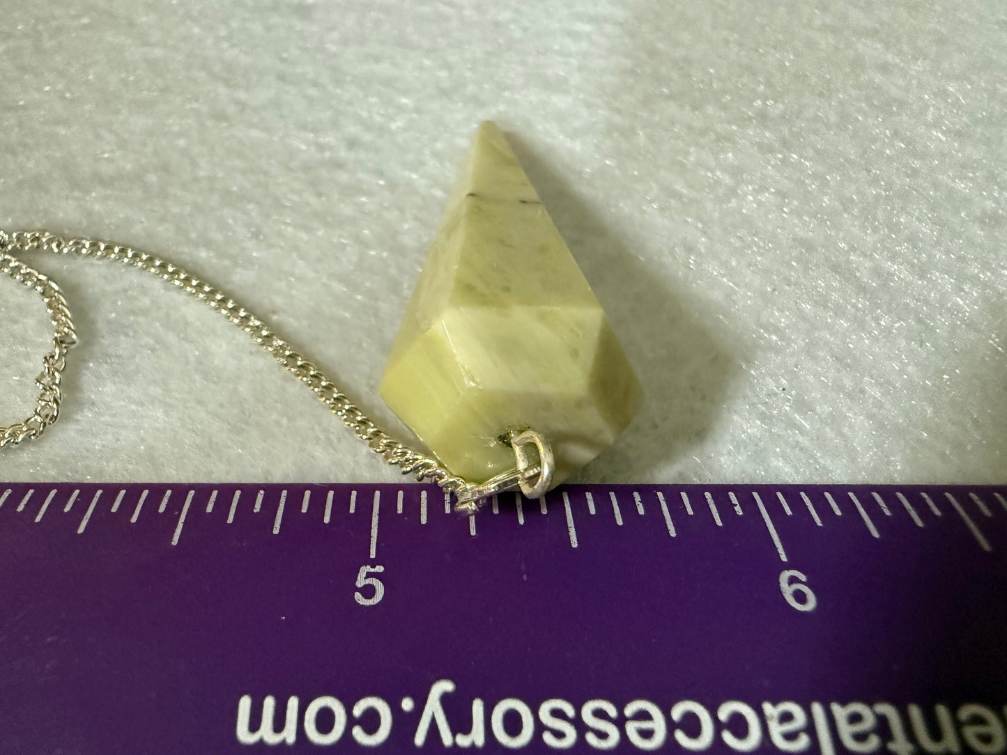 Awesome Serpentine Pendulum is  1.5” and with chain is 8.5”