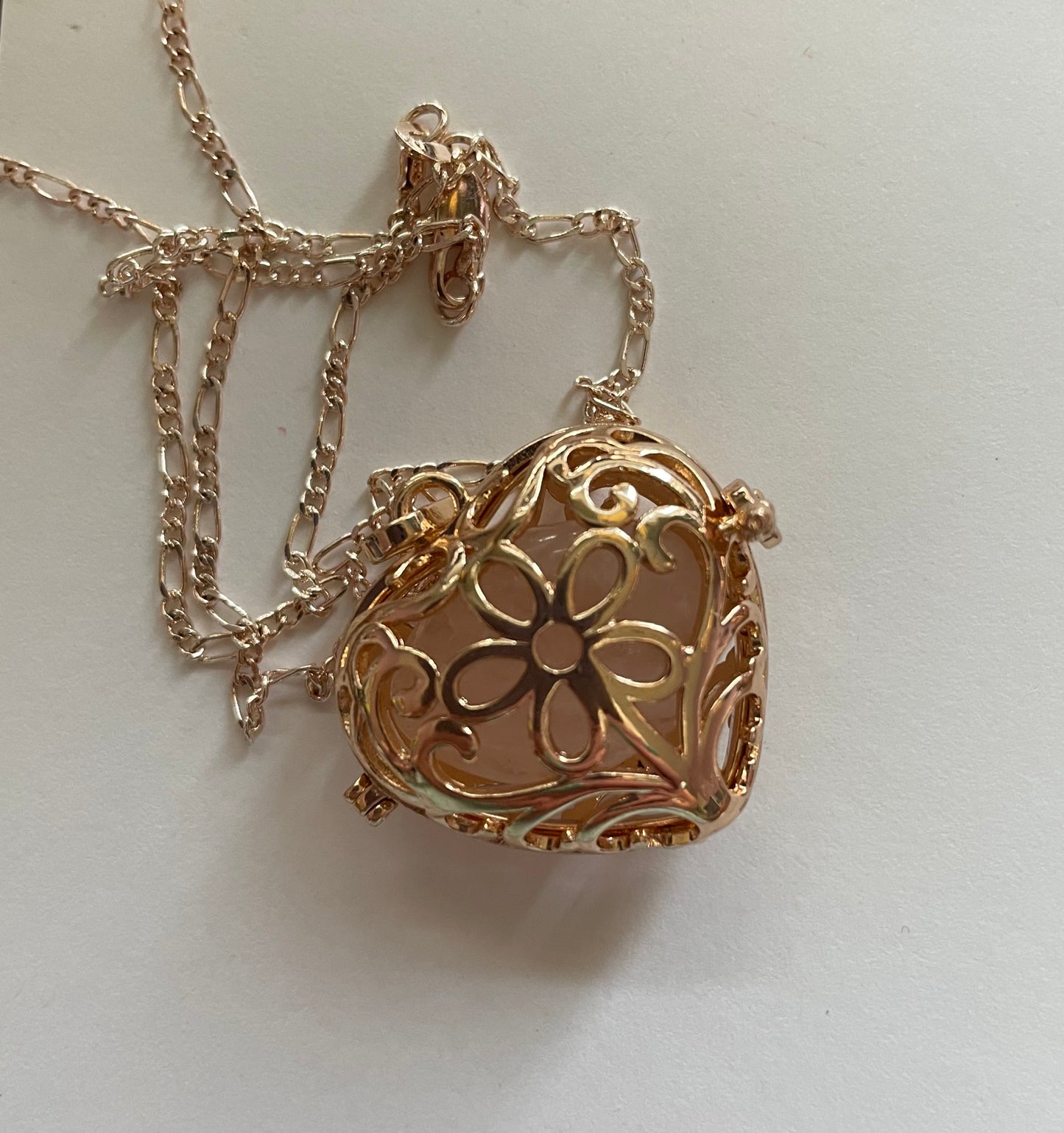 Gold locket filled with 6 interchangeable crystals on 18” rose gold chain
