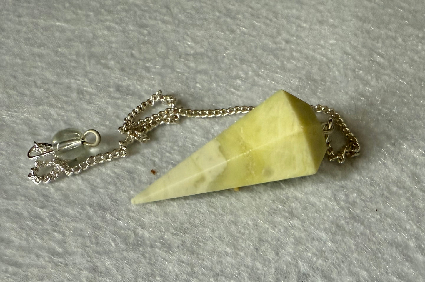 Beautiful Serpentine Pendulum is  1.5” and with chain is 8.75”