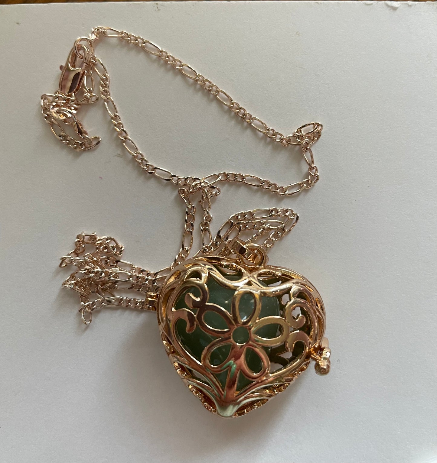 Gold locket filled with 6 interchangeable crystals on 18” rose gold chain