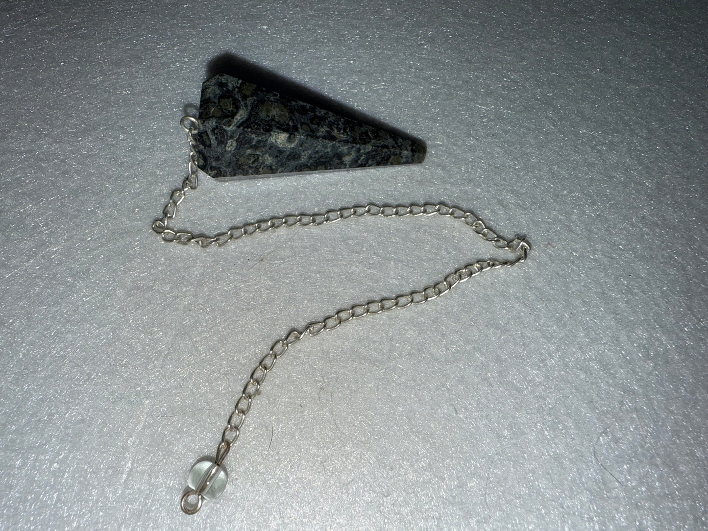 Serpentine Pendulum is  1.75” and with chain is 9.25”