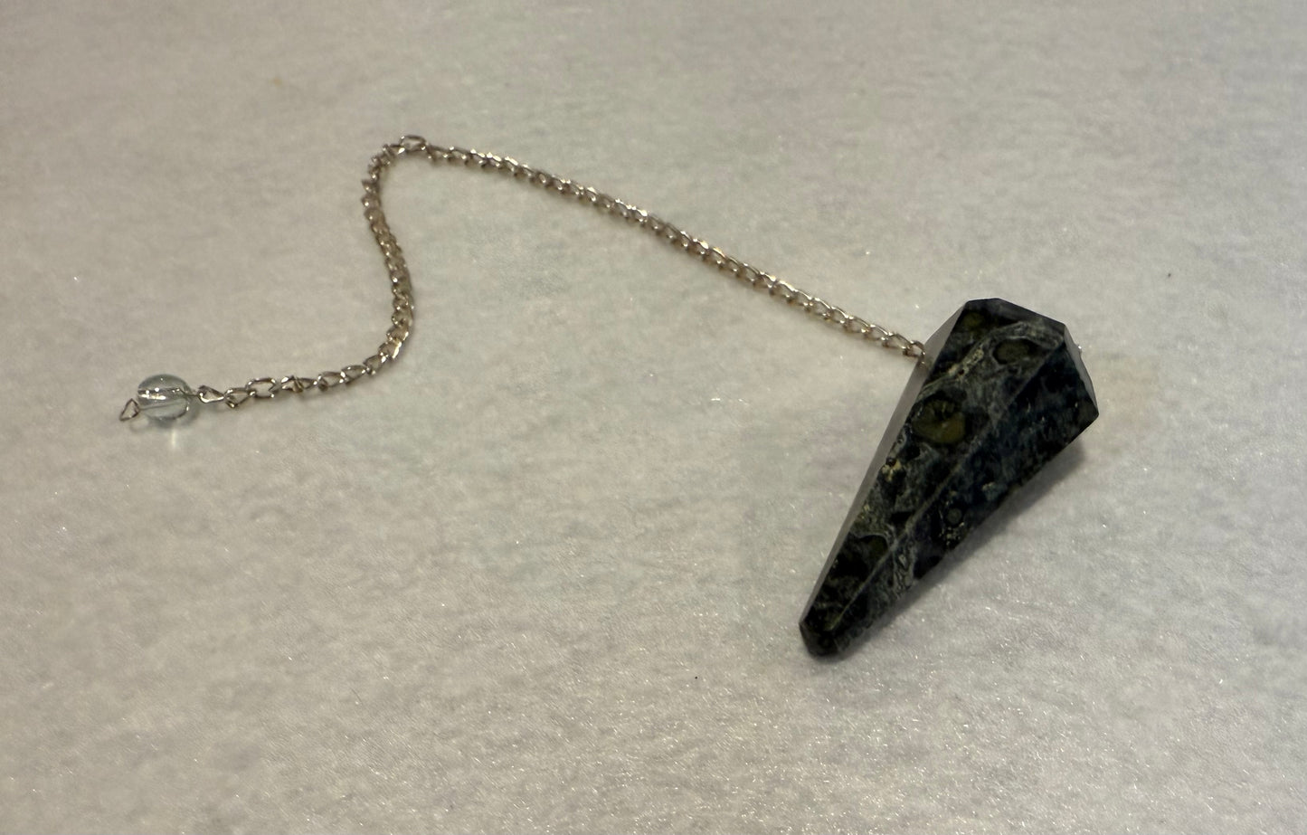 Pretty Kambaba Jasper Pendulum is  1.5” with chain is 9.25”