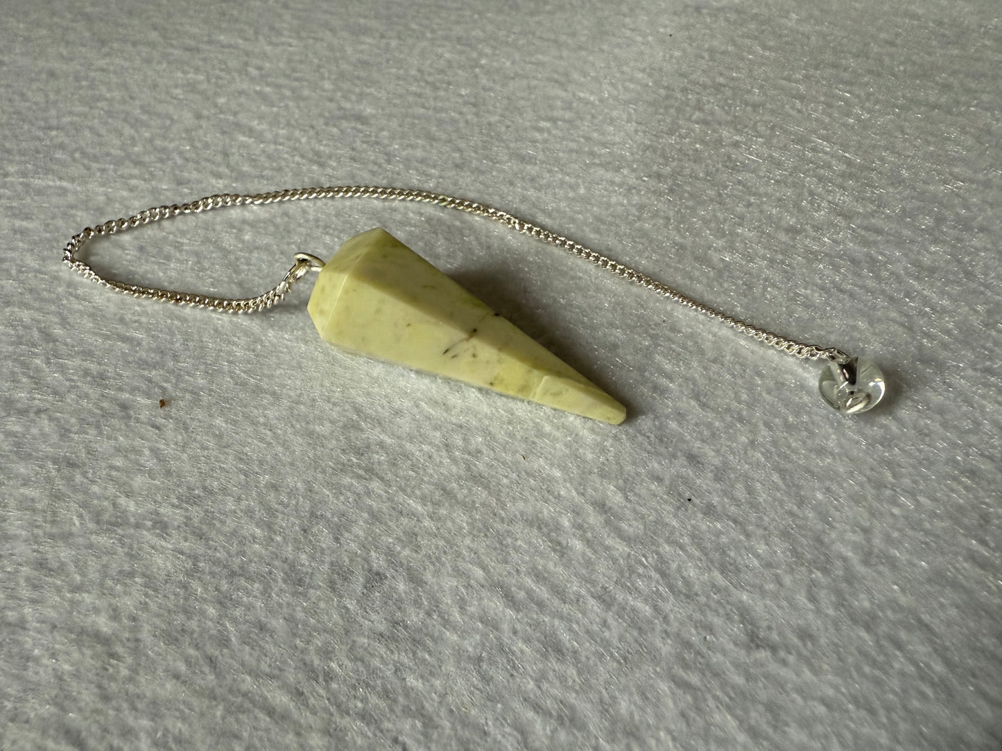 Awesome Serpentine Pendulum is  1.5” and with chain is 8.5”
