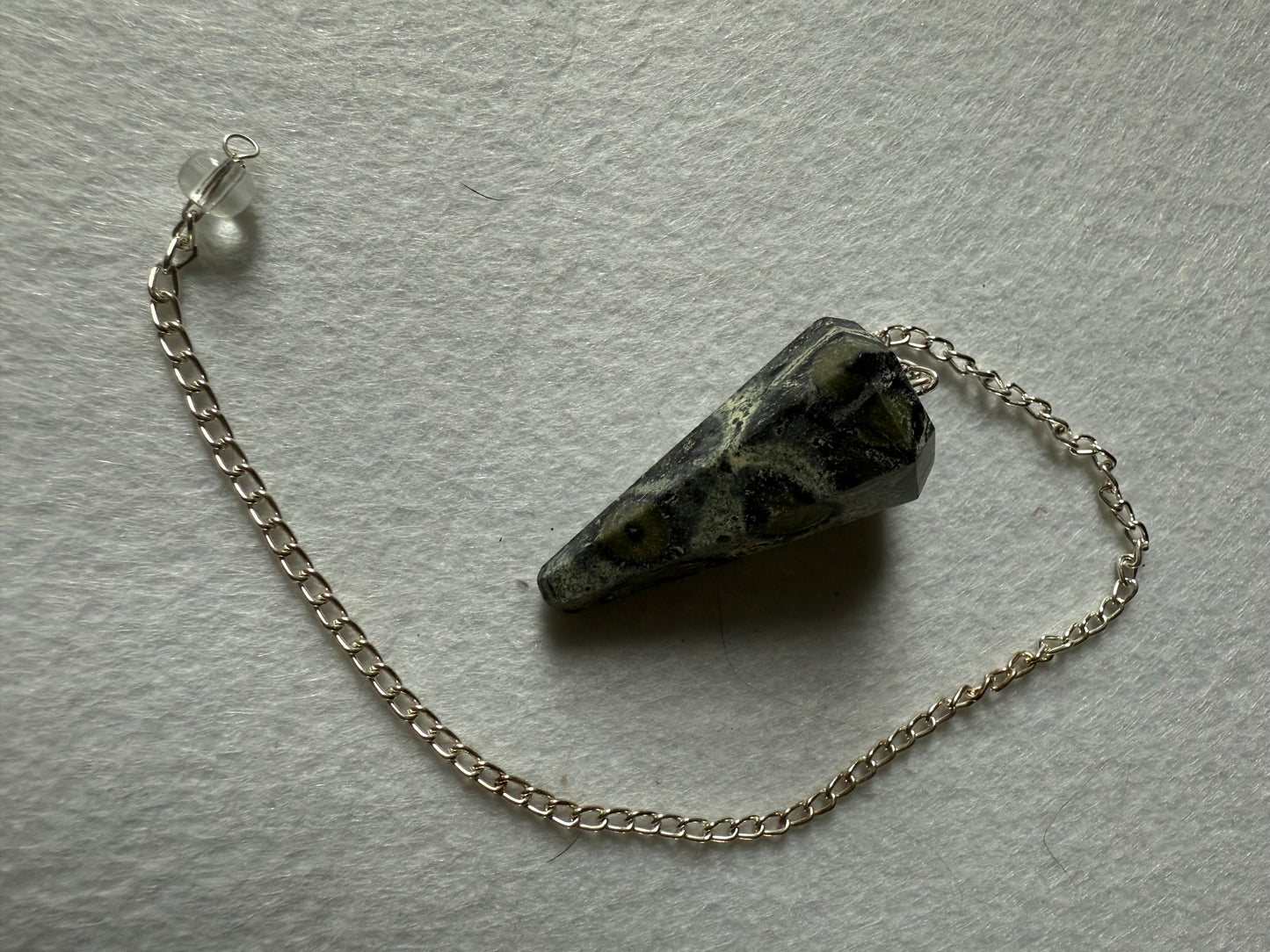 Awesome Kambaba Jasper Pendulum is  1.5” with chain is 9.75”