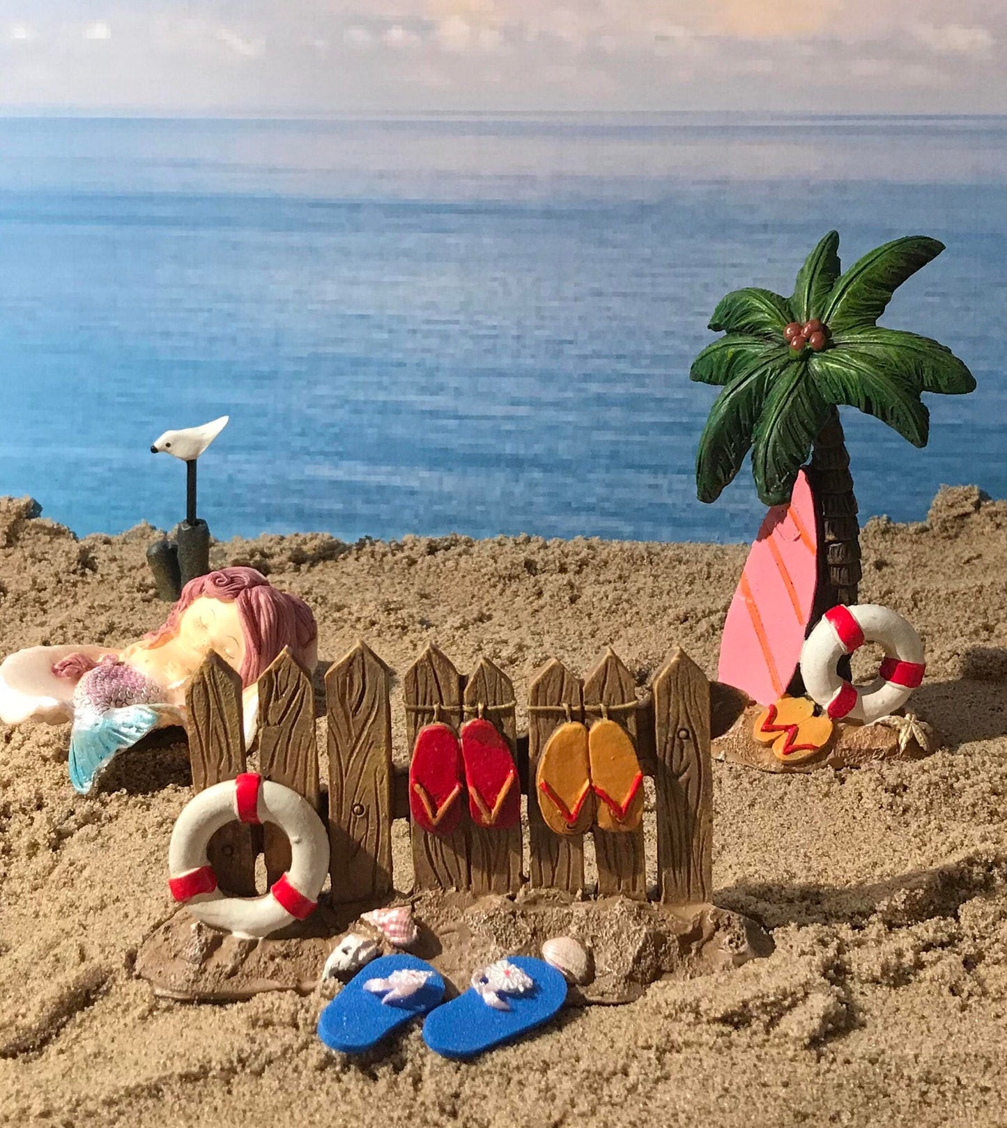 Fairy garden mermaid nestled sweetly in a shell