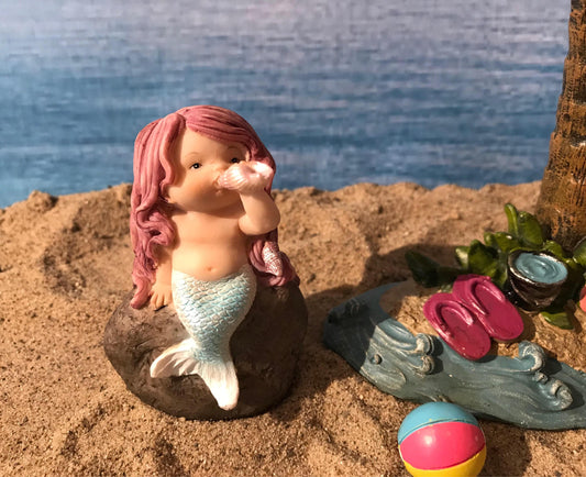 Adorable mermaid blowing a seashell. mermaid playing with a shell to make music, beach miniatures, nautical miniatures, fairy garden beach