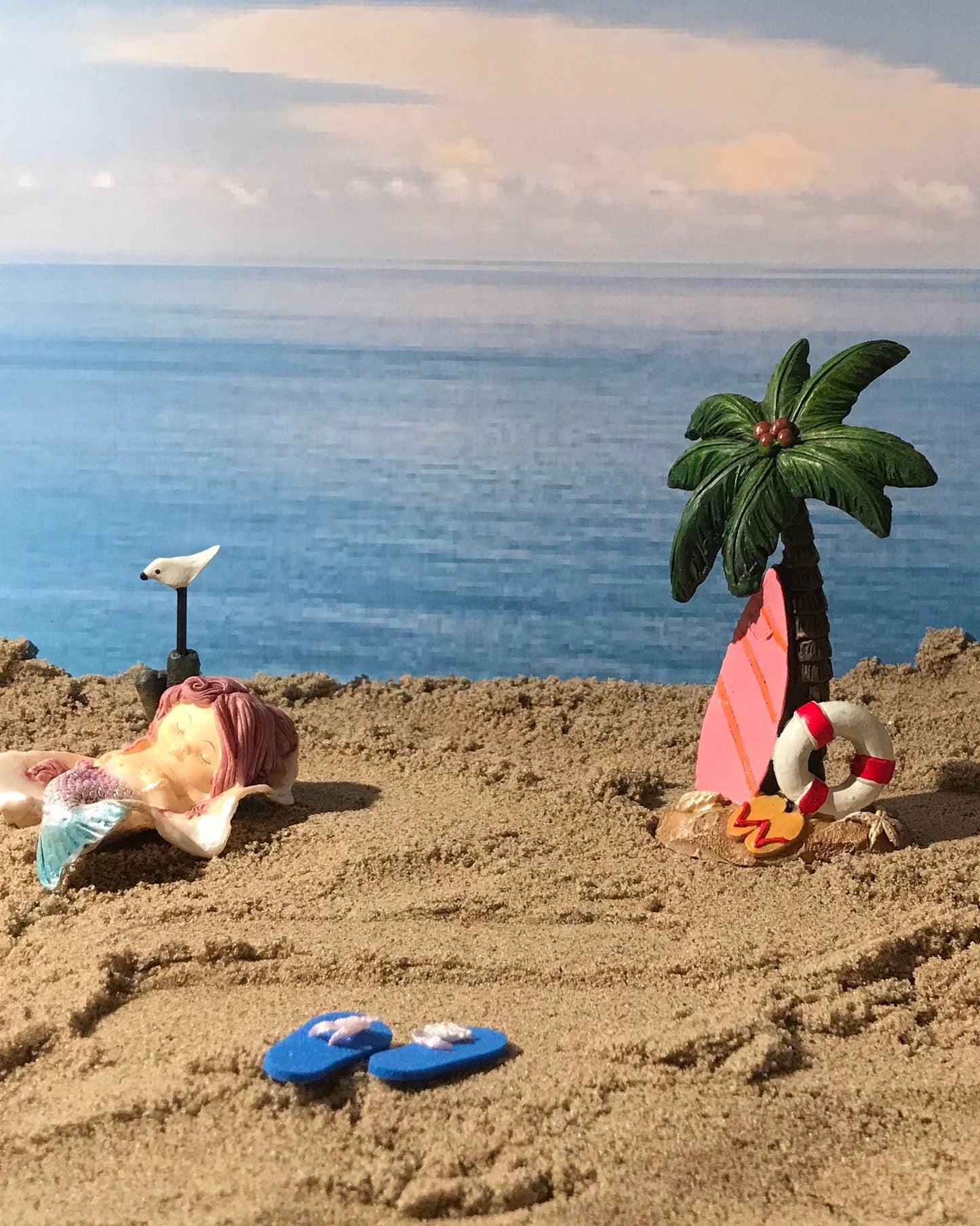 Fairy garden mermaid nestled sweetly in a shell