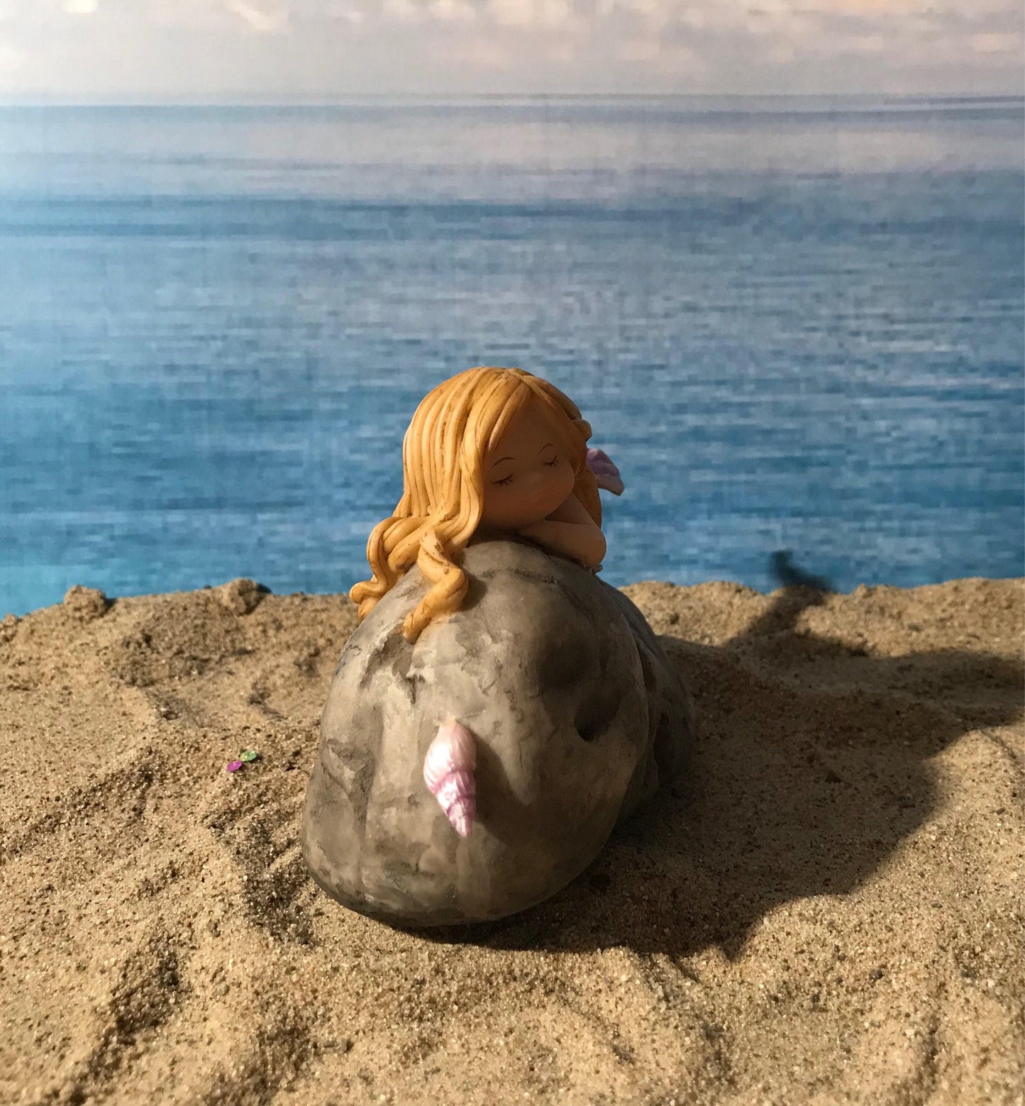 Pretty fairy beach garden mermaid with blonde hair. Miniature mermaid. Beach theme fairy garden.