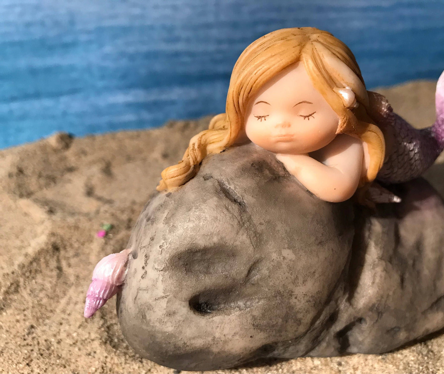 Pretty fairy beach garden mermaid with blonde hair. Miniature mermaid. Beach theme fairy garden.