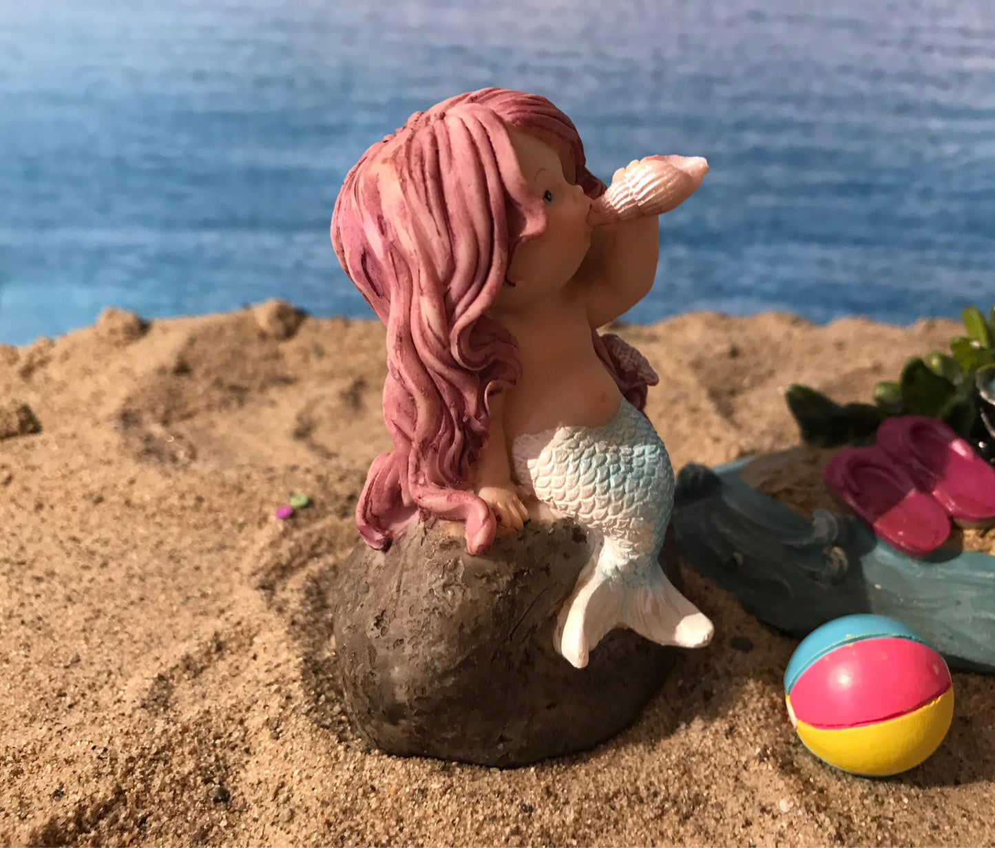 Adorable mermaid blowing a seashell. mermaid playing with a shell to make music, beach miniatures, nautical miniatures, fairy garden beach