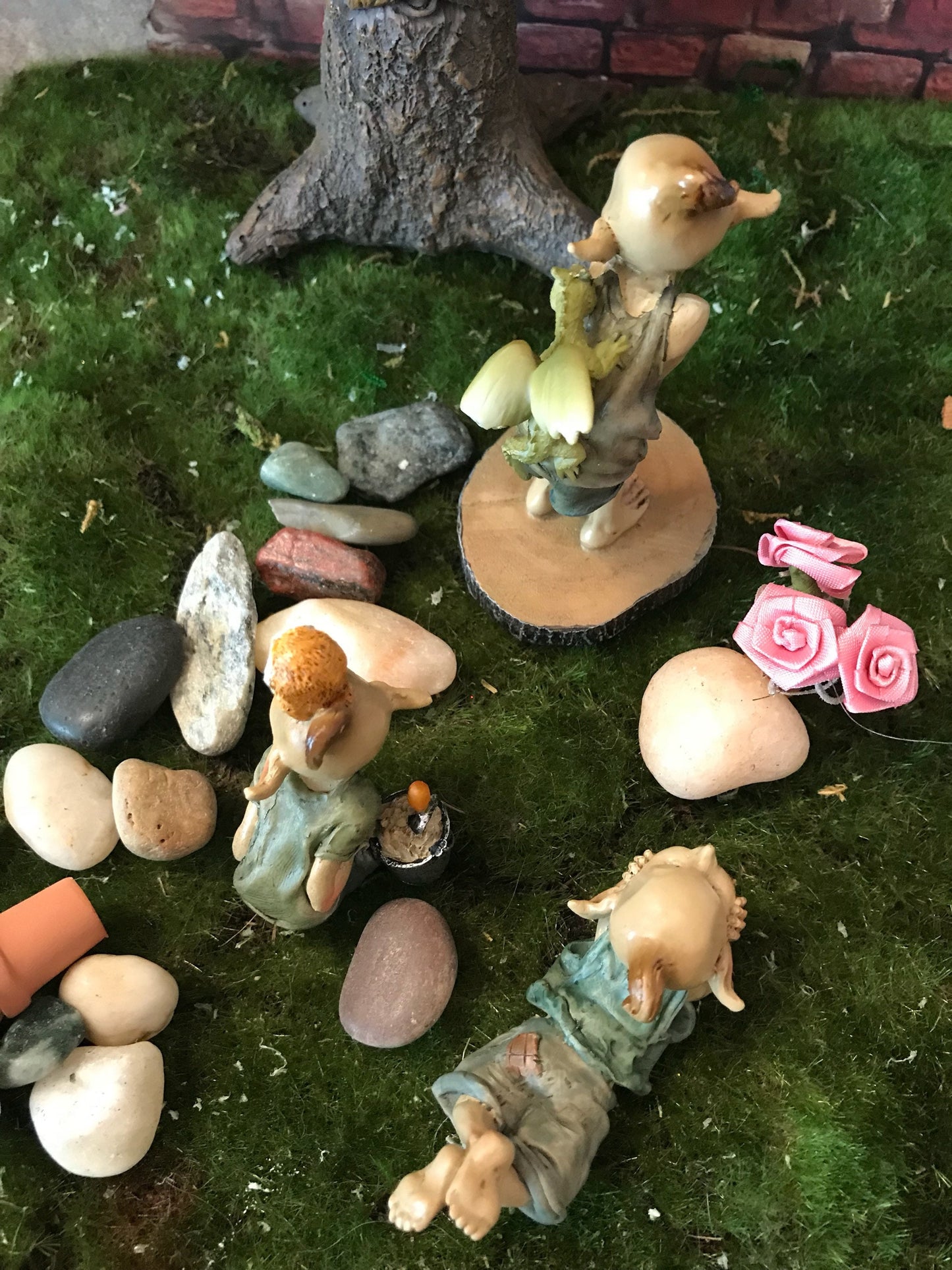 Pixie lovers garden pixie and baby dragon, pixie laying on tummy in thought, pixie gardening with shovel and bucket and owl sitting on head