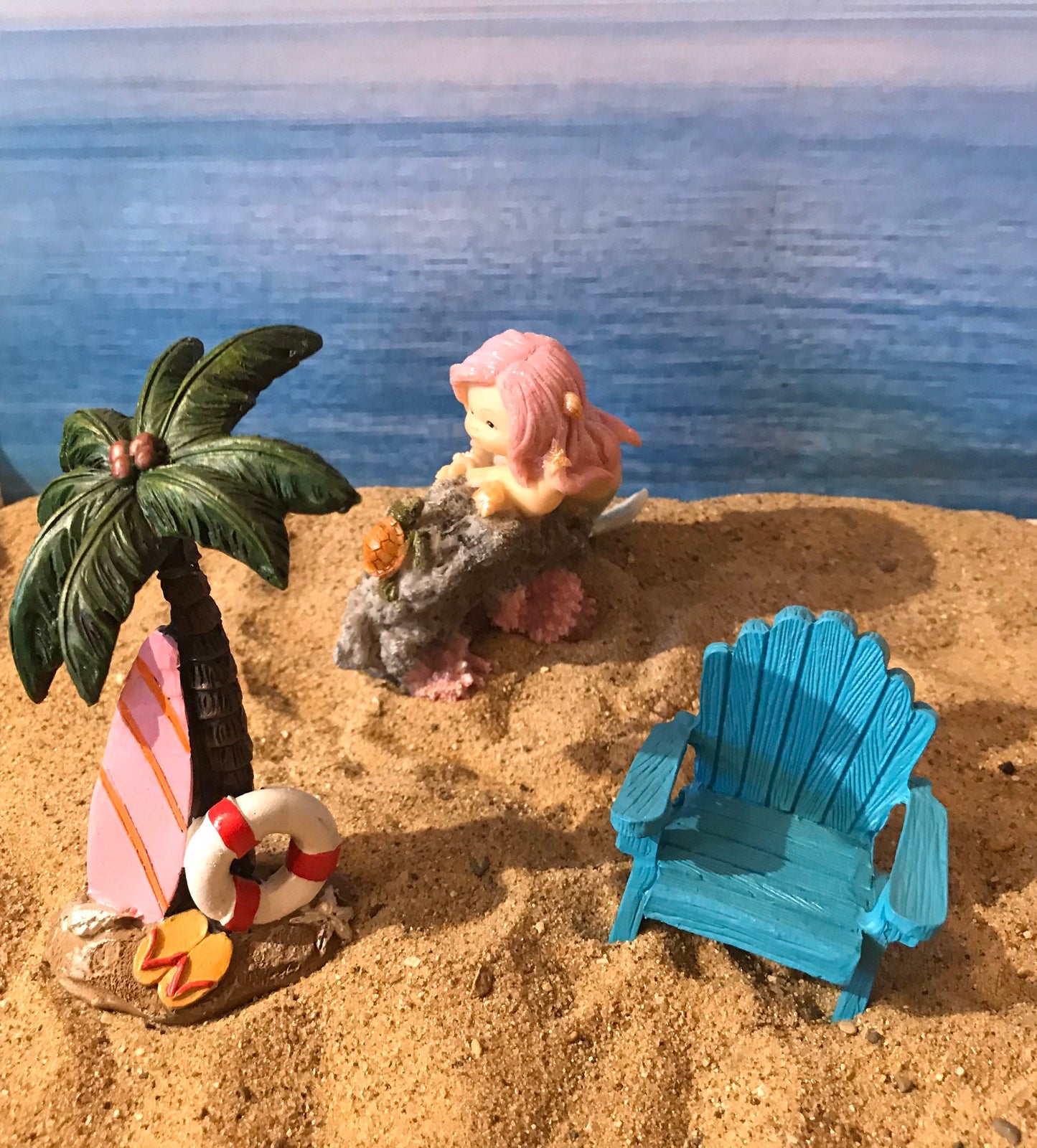 Pretty miniature mermaid playing with turtle on rock fairy garden mermaid with pink flowing hair beach nautical miniature playful mermaid
